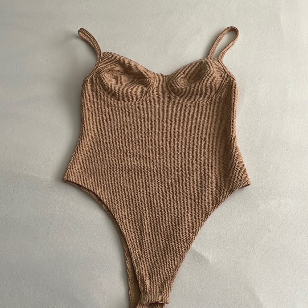 tan body suit, corset looking